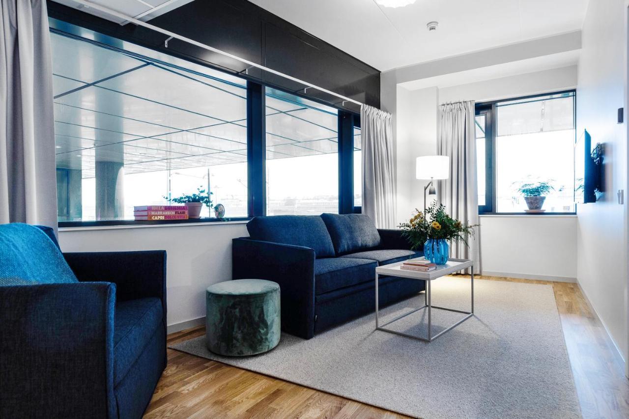 Biz Apartment Bromma Stockholm Exteriér fotografie A living room in a serviced apartment